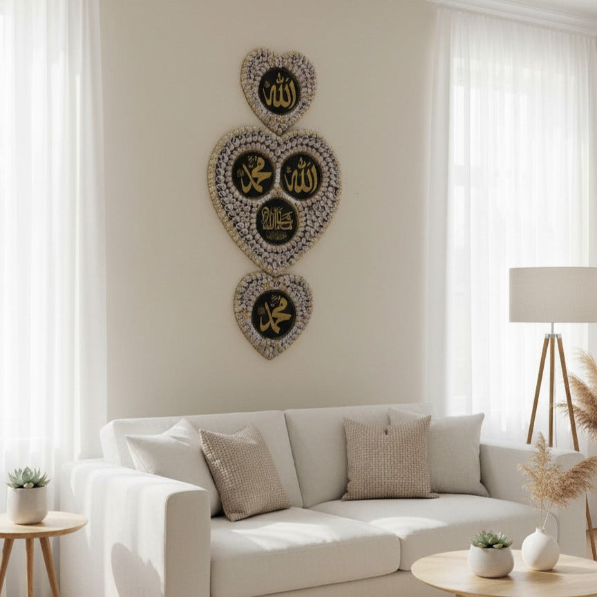 Living room with a white sofa, decorative pillows, and Islamic wall art.