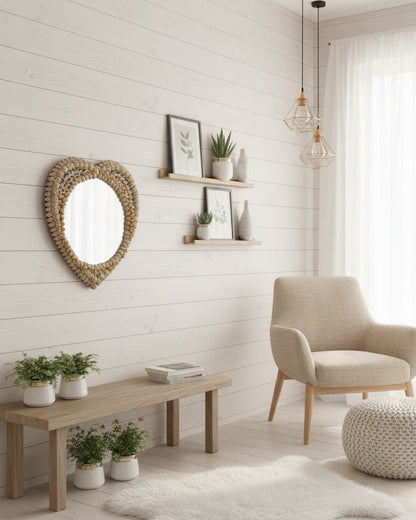 Modern living room with a heart-shaped mirror, armchair, and wooden coffee table.