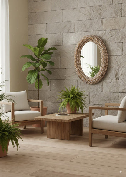 Living room with wooden furniture, oval shaped seashell handcrafted mirror plants, and a stone wall.