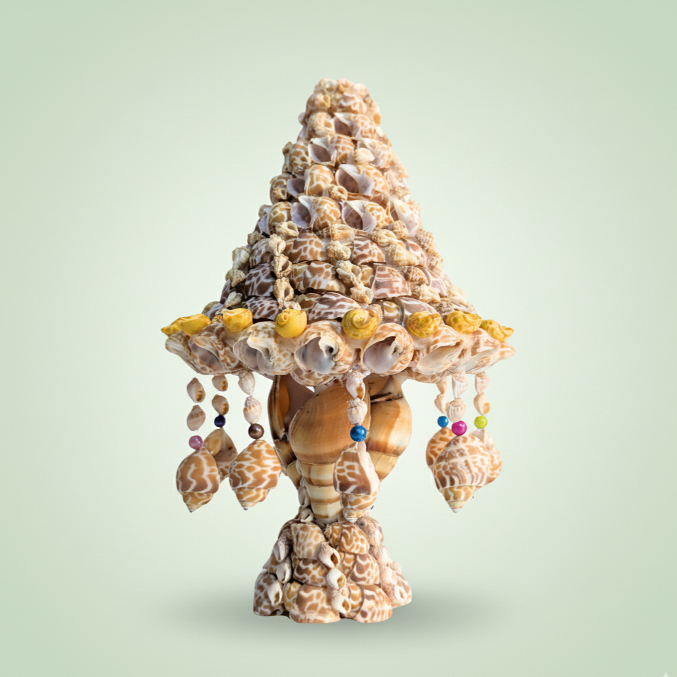 Shell sculpture table lamp with decorative elements on a light green background