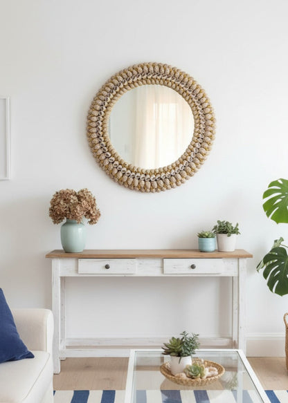 Living room with a round seashell mirror, console table, and decor items.