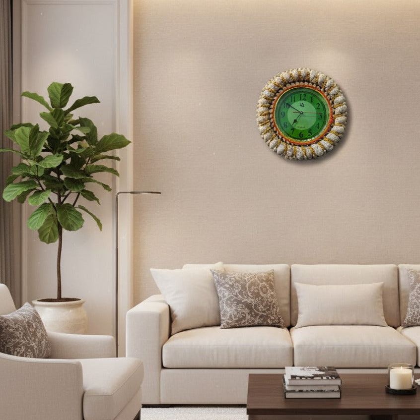 Modern living room with a beige sofa, armchair, and decorative wall clock.
