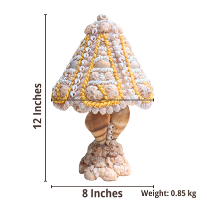 Decorative shell table lamp with measurements on a white background