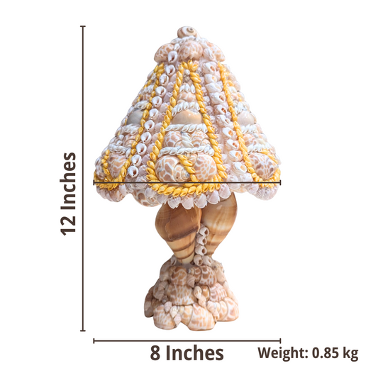 Decorative shell table lamp with measurements on a white background